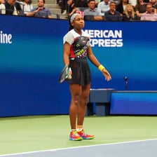 Coco Gauff competing in a professional tennis match.