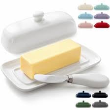 A stick of margarine sits on a kitchen counter.