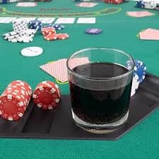 Poker chips placed in the center of a table before a hand.
