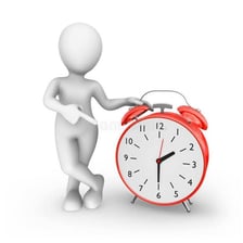 A person pointing toward a clock.