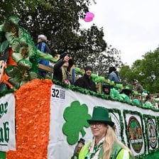A Saint Patrick’s Day parade featuring green clothing and decorations.