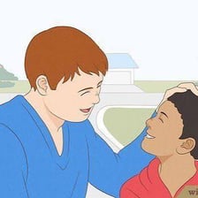 A person giving another person a playful gentle tap on the head