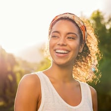 A smiling person looking energetic and well.