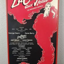 A theatrical production image associated with La Cage aux Folles.