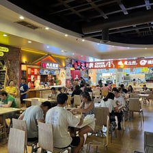 A busy food court inside a shopping mall
