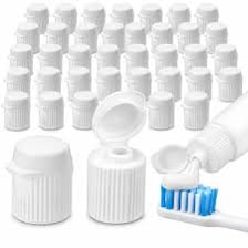 A hand removing the cap from a toothpaste tube.