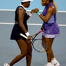 Women tennis players competing in a professional match