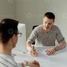 A consultant speaking with someone seeking advice