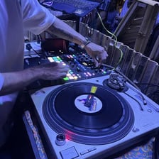 A deejay mixing music at turntables