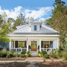A residential porch with a mailbox near the entrance.
