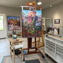 Artist creating a work of art in a studio