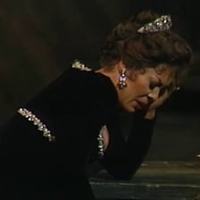An opera singer performing onstage during an aria