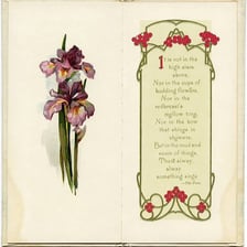 An open antique book of poetry