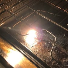 The heated interior of an open oven.