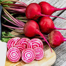 Several red beets with leafy stems