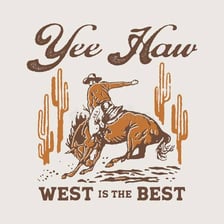A cowboy in a Western setting celebrating with a raised arm.