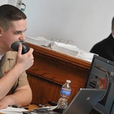 A court stenographer typing during a legal proceeding