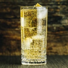 A glass of Scotch and soda served over ice.