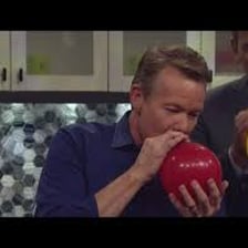 A person speaking after inhaling helium from a balloon