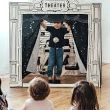 Actors performing a drama on a theater stage.