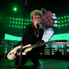 The rock band Green Day performing onstage