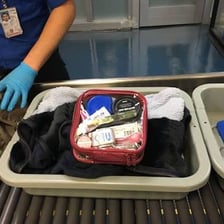 A TSA security checkpoint screening passengers and carry-on bags