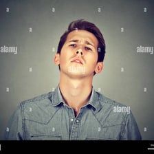 A person displaying an overly confident, brazen expression.