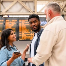 Two people conversing, with one signaling understanding