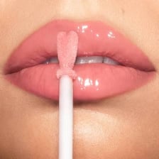 Lip gloss being applied to a person’s lips.