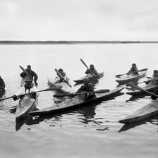 A traditional Inuit kayak on the water.