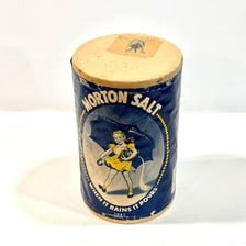 A Morton Salt container featuring the girl with an umbrella.