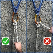 A person lowering an object downward with a rope.