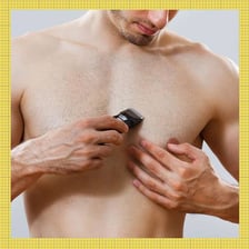 Man grooming or removing hair from his chest