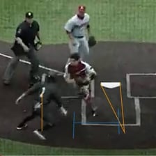 A baseball runner touching home plate