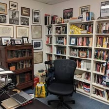 A university faculty member working in an academic office.