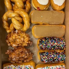 A box containing a dozen doughnuts.