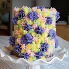 A decorator applying icing to a cake
