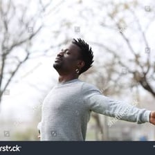 A person taking a breath outdoors