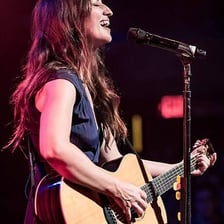 Singer Sara Bareilles performing onstage