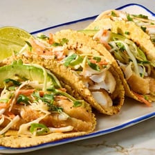 Fish tacos topped with shredded coleslaw
