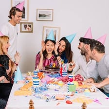 People preparing decorations for a surprise party.
