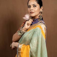 A traditional South Asian sari displayed as a long draped garment.