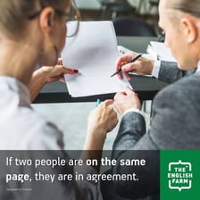 Two people smiling and gesturing in agreement.