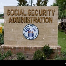 A sign identifying a Social Security Administration office.