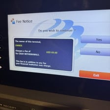 An ATM displaying a transaction fee notice