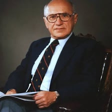 Milton Friedman speaking or posing in an economics-related setting.