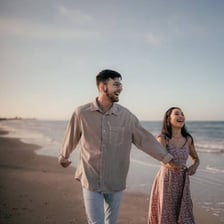 A newlywed couple enjoying a beach honeymoon getaway.