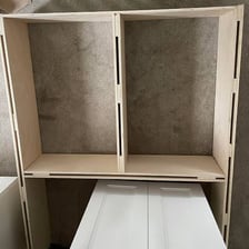 A shelf visibly sagging under a heavy load