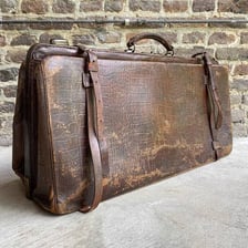 A small vintage leather travel bag