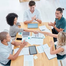 A group supporting a mission during a planning meeting.